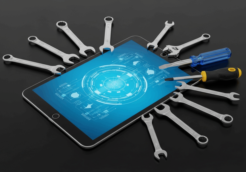 Tablet z grafiką w formie hologramu. Obok tabletu leży zestaw śrubokrętów